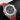 A close-up studio portrait focusing on the open-worked dial, white gold hands, large date wheel indicator at 12 o'clock, and sub-dials