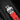 A close-up studio shot focusing on the red and black structured rubber strap and the sandblasted titanium AP-shaped folding deployment buckle