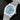 studio portrait focusing on the light ice blue dial texture, white gold applied markers, and date window at 3 o'clock
