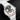 Dynamic angle of the silver textured dial, hour and minute eyes, and red grin mouth indicator on the Behrens x Konstantin Chaykin Joker