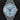 direct close-up studio front portrait of the 40mm platinum Chopard L.U.C XPS 1860 161954-9001 featuring a frosted ice-blue dial on a grained grey strap