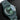 Perspective view displaying the diamond-patterned green dial, date window at 3 o'clock, and integrated ceramic bracelet links on the Girard Perregaux Laureato 38 Mm Green Aston Martin Edition 81005-32-3080-1Cx