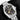 heavily textured black kawagane dial, gold power reserve hand, and date aperture at 3 o'clock