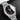 studio portrait focusing on the deep black dial face, multi-faceted indices, date window at 3 o'clock, and red tracking hand