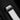 Detail of the black-plated titanium and white ceramic push-button deployment clasp on the Hublot white structured rubber strap