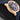 Close-up right profile view of the gold watch case highlighting the signed screw-down crown and integrated gold crown guards