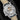 Rear studio view of the watch showing the sapphire crystal display caseback revealing the hand-finished manual-wind movement co-designed by Kari Voutilainen