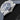 Close-up right profile view of the steel watch case highlighting the conical screw-in winding crown and integrated end-link rubber strap layout
