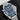 direct front studio shot of the Omega Seamaster Bond 60th Anniversary watch tilted slightly right showcasing the blue wave dial and lollipop seconds hand