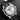 Perspective view displaying the skeleton hands, red Seamaster logo, date window at 6 o'clock, and helium escape valve on the Omega Diver 300M