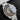 close-up studio portrait focusing on the grey dial, 18k Moonshine gold hour markers, and Buzz Aldrin descending sub-dial engraving under anti-reflective crystal