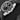 Close-up right profile view of the 44.25mm steel case highlighting the signed crown and two cylindrical chronograph pushers