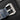 Rear view of the blue alligator strap secured by a heavy-duty oversized brushed steel trapezoidal pin tang buckle engraved with the Panerai logo