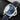 Angled front view of the 44mm stainless steel Panerai Luminor Marina PAM 01313 displaying the blue sandwich dial and luminous Arabic numerals