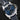 Front-angled view highlighting the radiant sun-brushed blue sandwich dial layout, ecru Super-LumiNova hour markers, and central GMT dual-time arrow hand