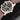 Close-up right profile view of the gold watch case highlighting the signed fluted crown and polished down-turned lugs