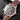 angled studio top-down view of the 18k rose gold Patek Philippe 5524R highlighting its polished case lines and brown leather strap