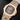 angled studio top-down view of the 18k rose gold Patek Philippe Nautilus highlighting its satin-brushed bezel and integrated link bracelet