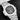 A studio portrait focusing on the horizontally embossed black gradient dial, date sub-dial, and chronograph counter