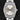 Close-up view of a pre-owned 2021 Rolex Oyster Perpetual 34 ref. 124200 featuring a silver sunray dial with yellow gold luminous baton markers, available at Lone Star Timepieces Dallas