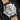 Sapphire exhibition caseback revealing the automatic movement and custom Bull & Bear engraved rotor on the Sinn 6068.010