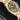 High-angle profile view showcasing the uniform brushed finish of the 18ct yellow gold case and coin-edge bezel on the Tudor Black Bay 58