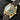 Angled front view of the 39mm Tudor Heritage Black Bay 18kt yellow gold case with green dial and matching green bezel