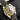 Detailed view of the matte green dial and gold snowflake hands on the preowned Tudor Black Bay 18kt 79018V-0001