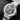 angled studio top-down view of the titanium Ulysse Nardin Diver X Skeleton highlighting its concave white bezel and rubber strap