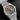 close-up studio portrait focusing on the architectural grey open-worked dial, rose gold indices, and lightning-fast 1/10th of a second counter at 6 o'clock
